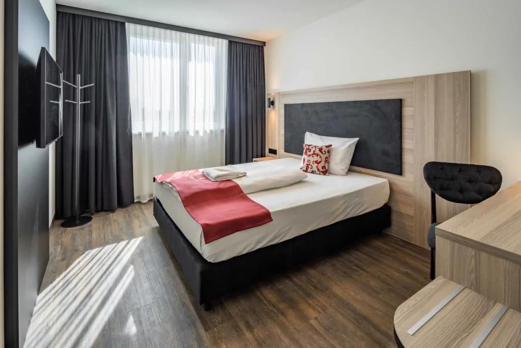 Hotel room with double bed at Abasto Hotel Dachau